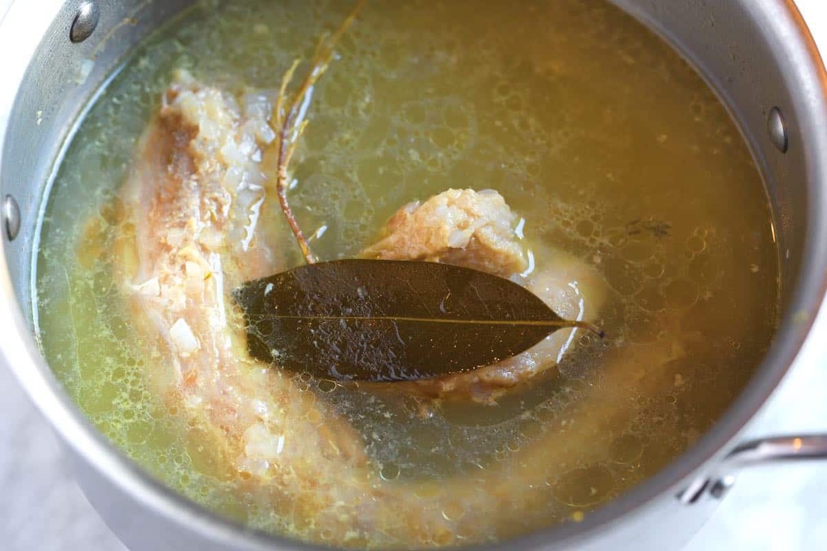 Making a quick onion broth with turkey neck and giblets for turkey gravy