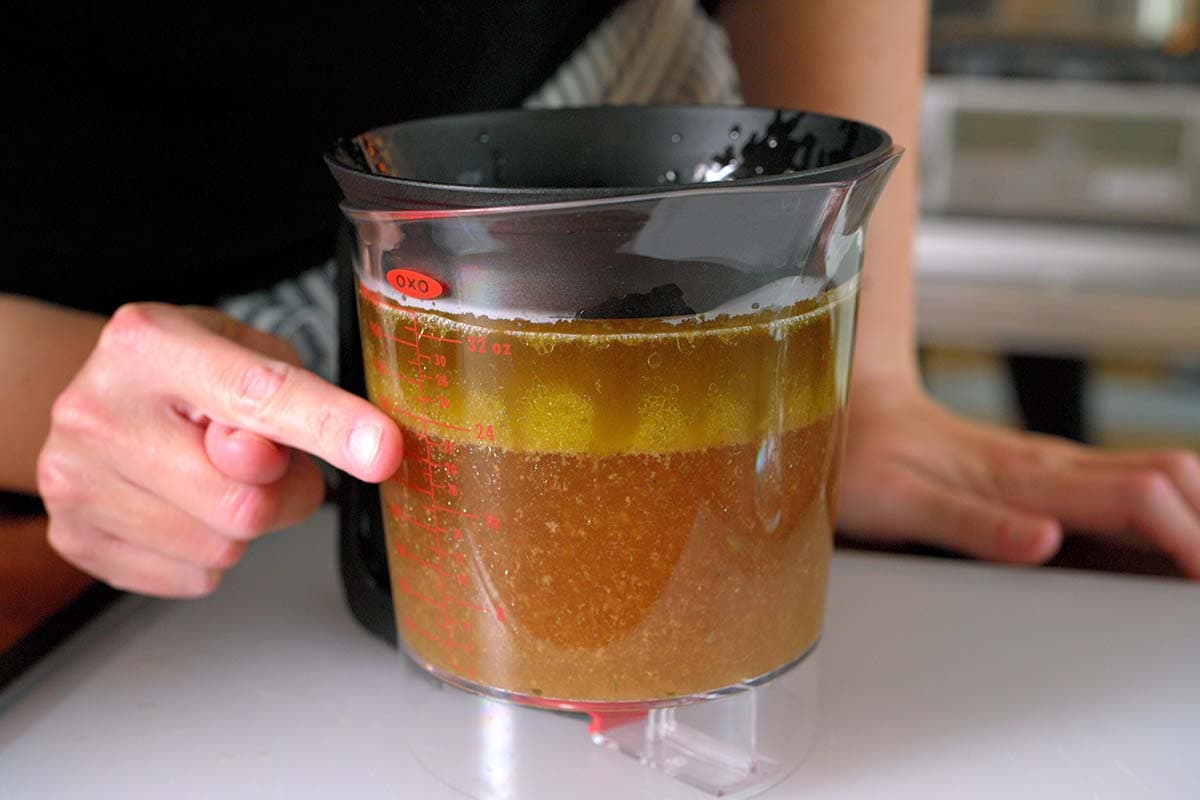 Separating the fat from pan drippings for homemade turkey gravy
