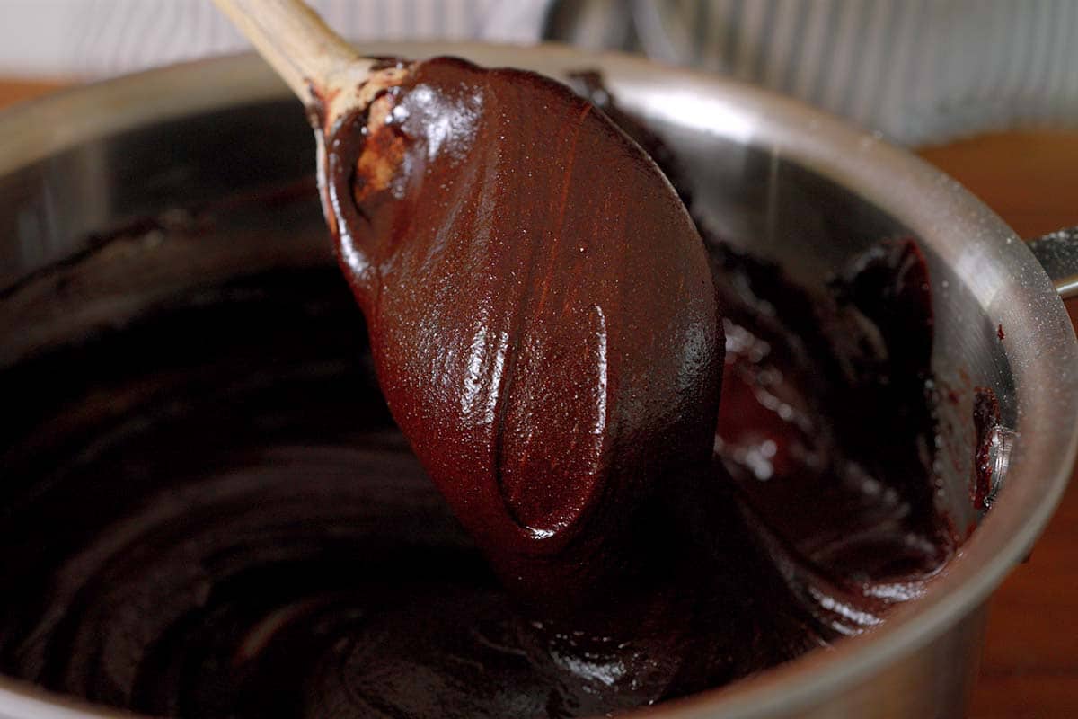 Making the brownie batter in a saucepan.