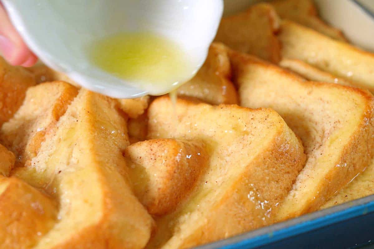 Pouring butter and adding cinnamon sugar to the top