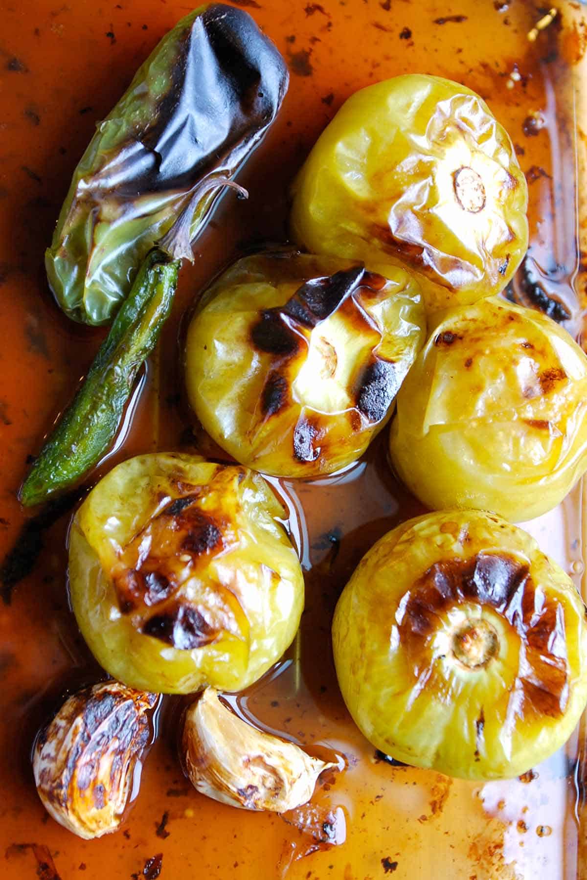 Roasted ingredients for tomatillo salsa verde