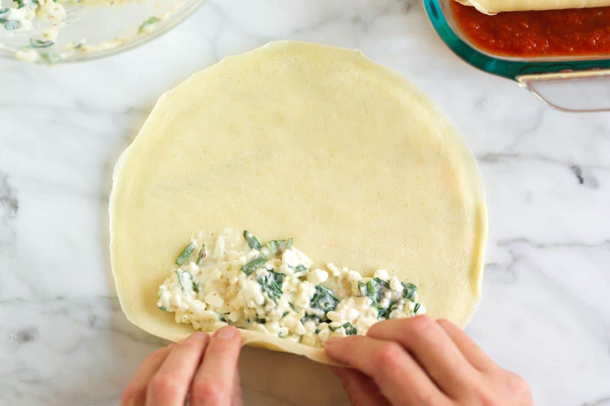 Stuffing manicotti with cheese filling