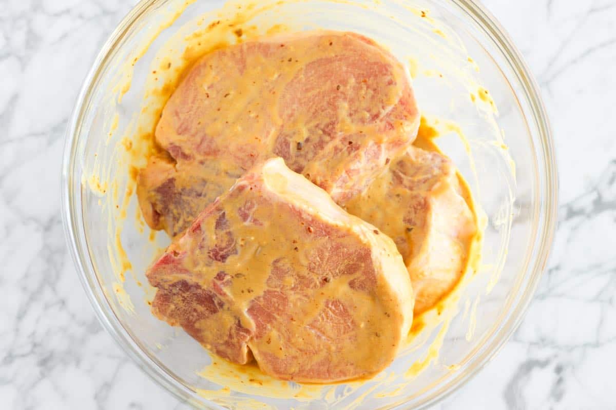 Pork chops marinating in the thick marinade
