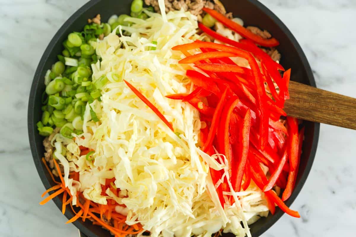 Cooking the ground meat and veggies for an egg roll bowl
