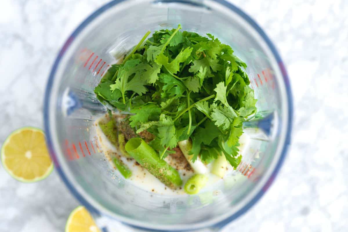 Blending cilantro lime dressing ingredients. 