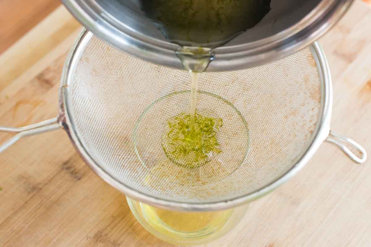 Straining Zest to make Lime Cordial for a gimlet