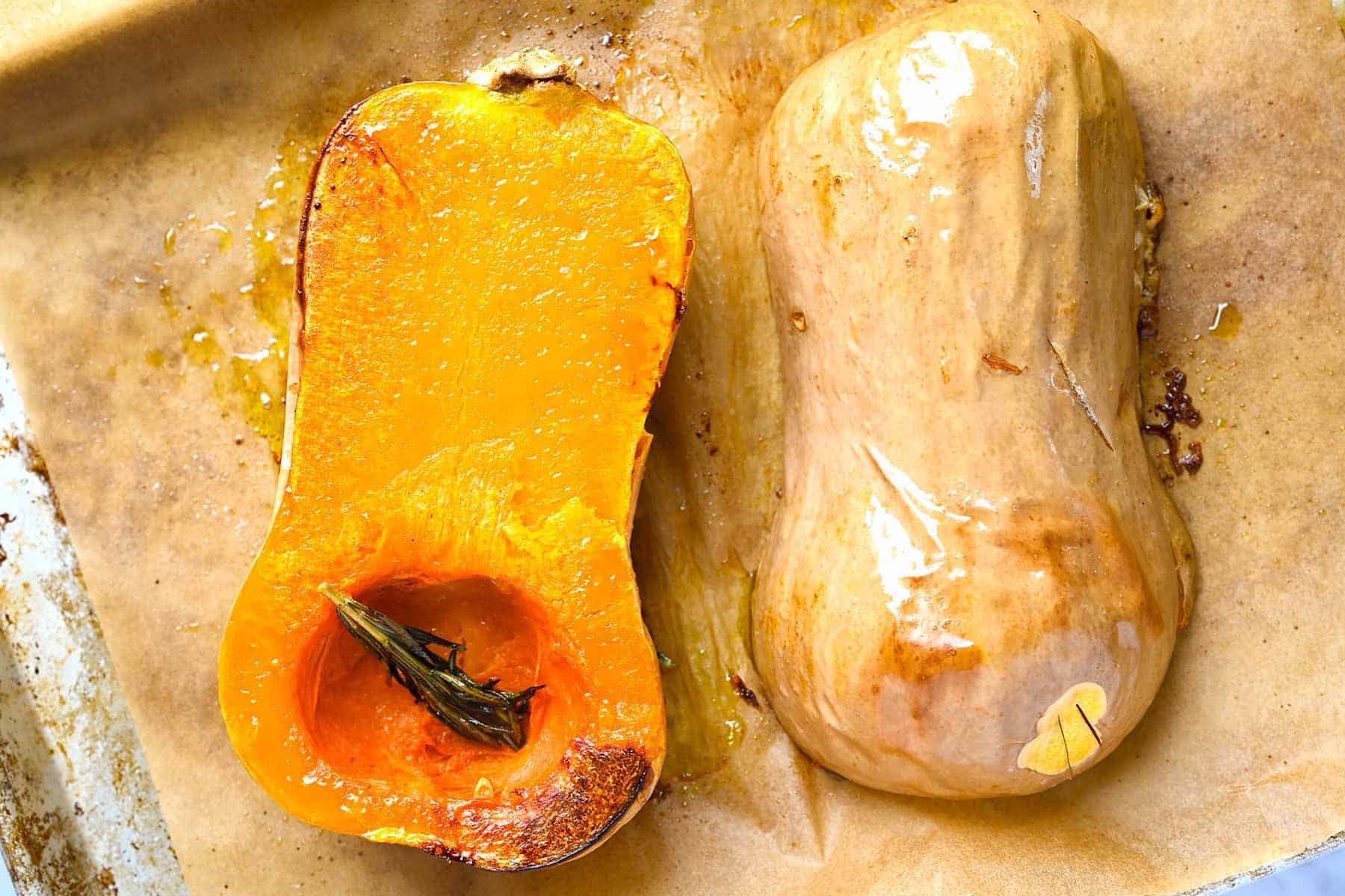 Roasted butternut squash on a baking sheet.