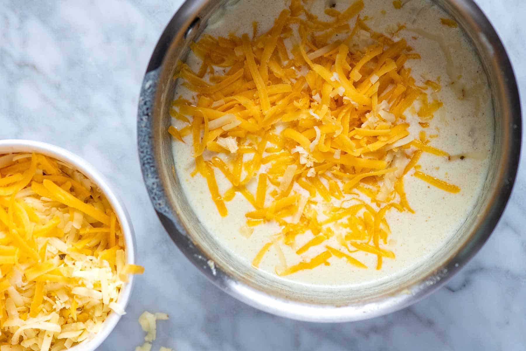 Adding cheese to make queso dip