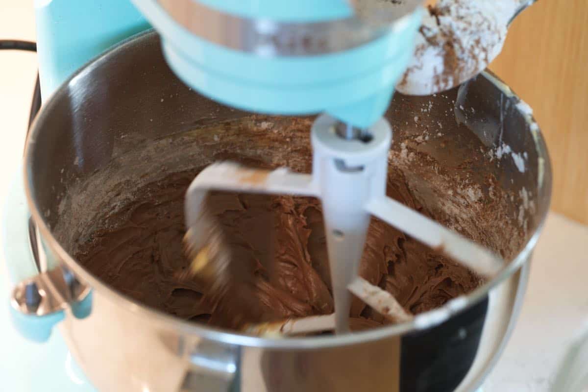 Chocolate Buttercream Recipe Step: Adding sifted cocoa and powdered sugar to the butter