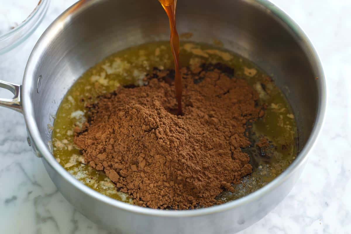 Heating cocoa with butter and oil for a moist cake.