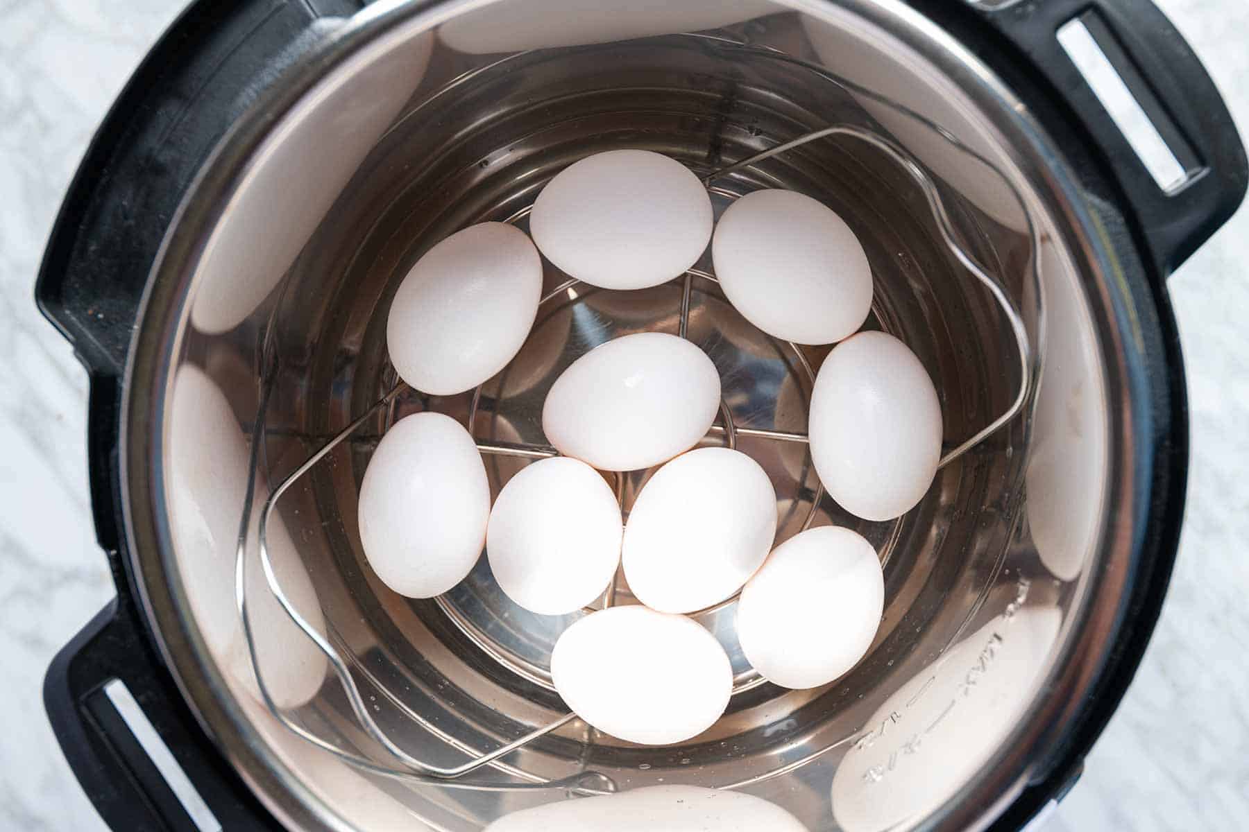 Eggs on a trivet at the bottom of an Instant Pot