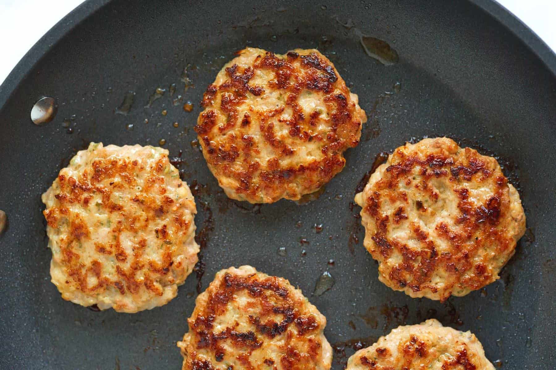 Cooking breakfast sausage patties in a skillet