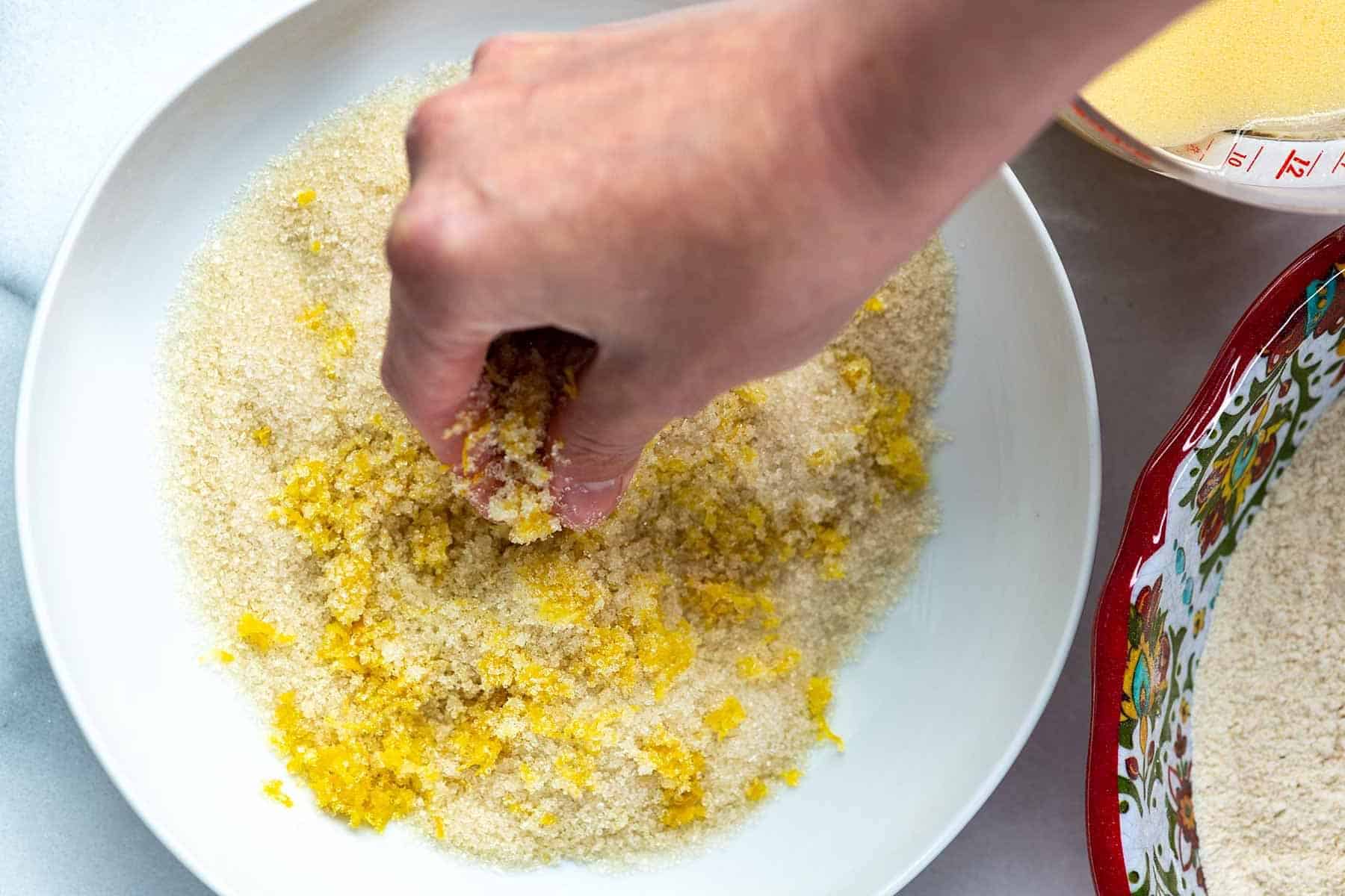 Making lemon flavored sugar for lemon blueberry muffins batter