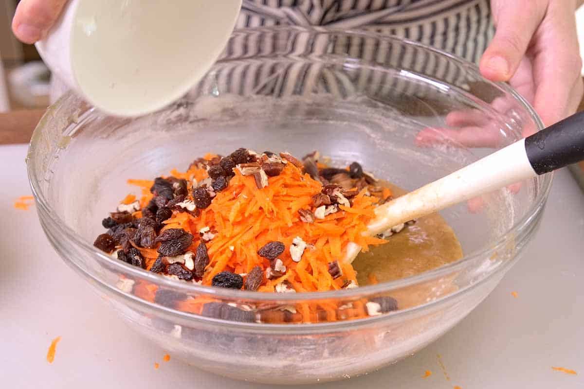 Folding in carrot cupcake ingredients