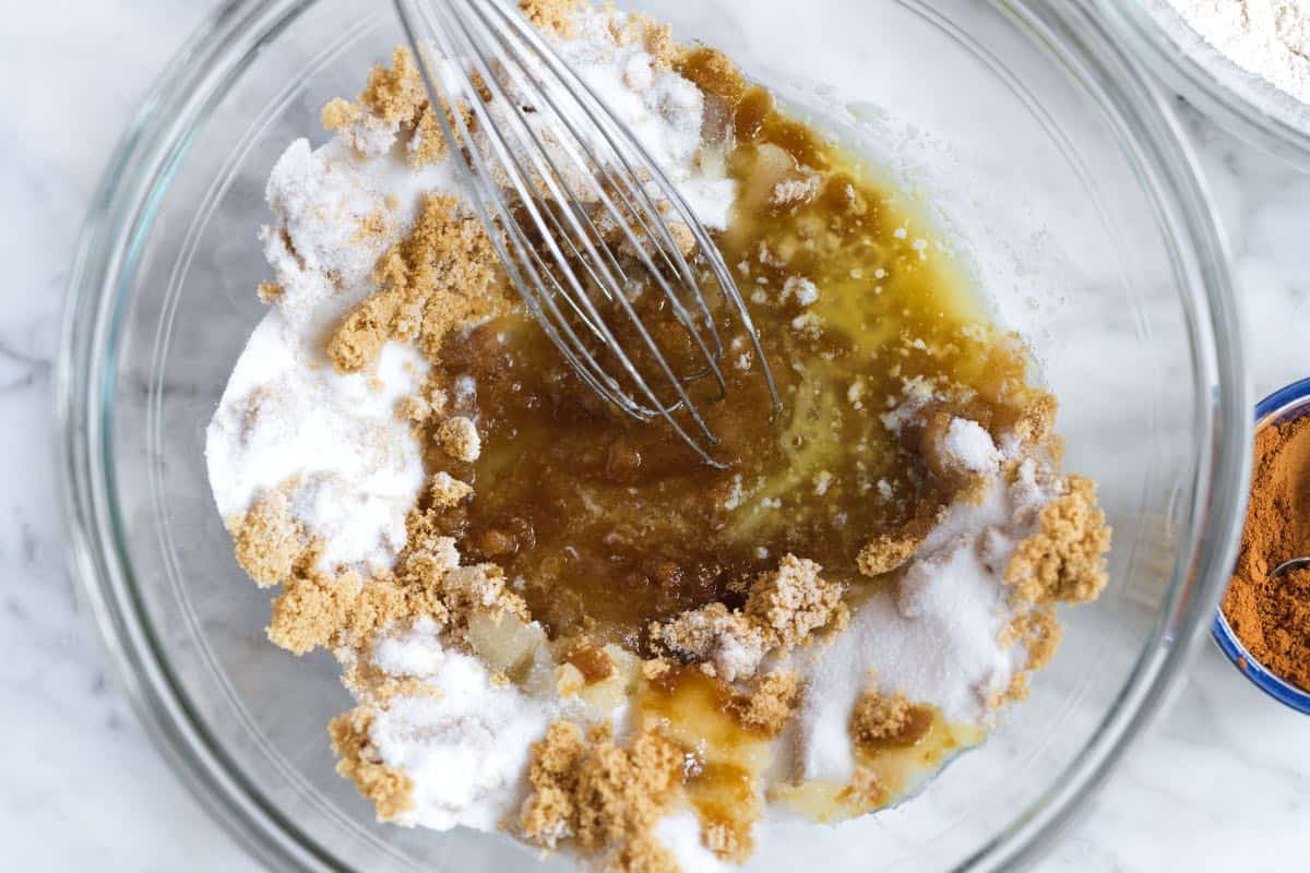Mixing melted butter into sugar