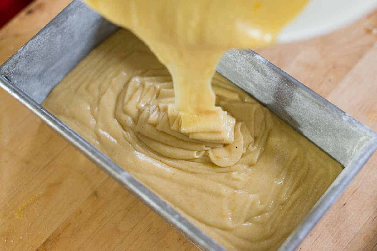 Pouring cake batter into pan