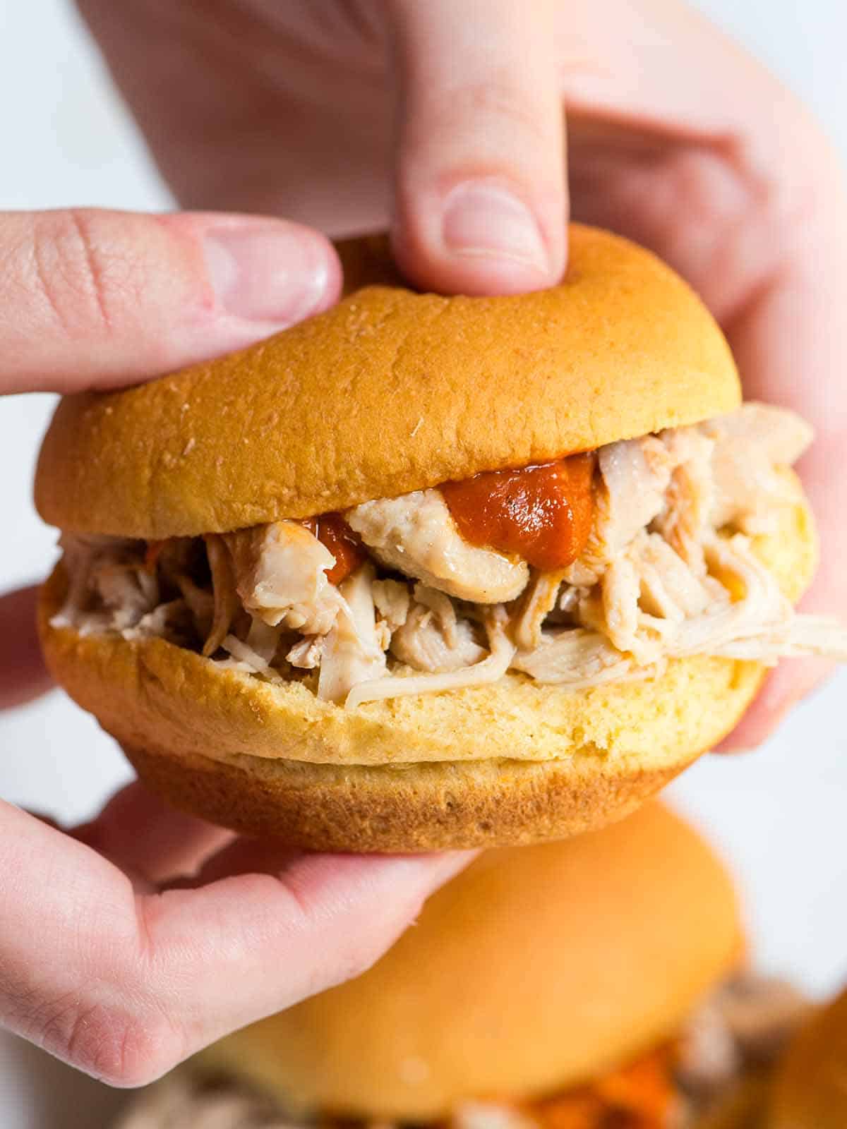 Slow Cooker Shredded Chicken on a sandwich