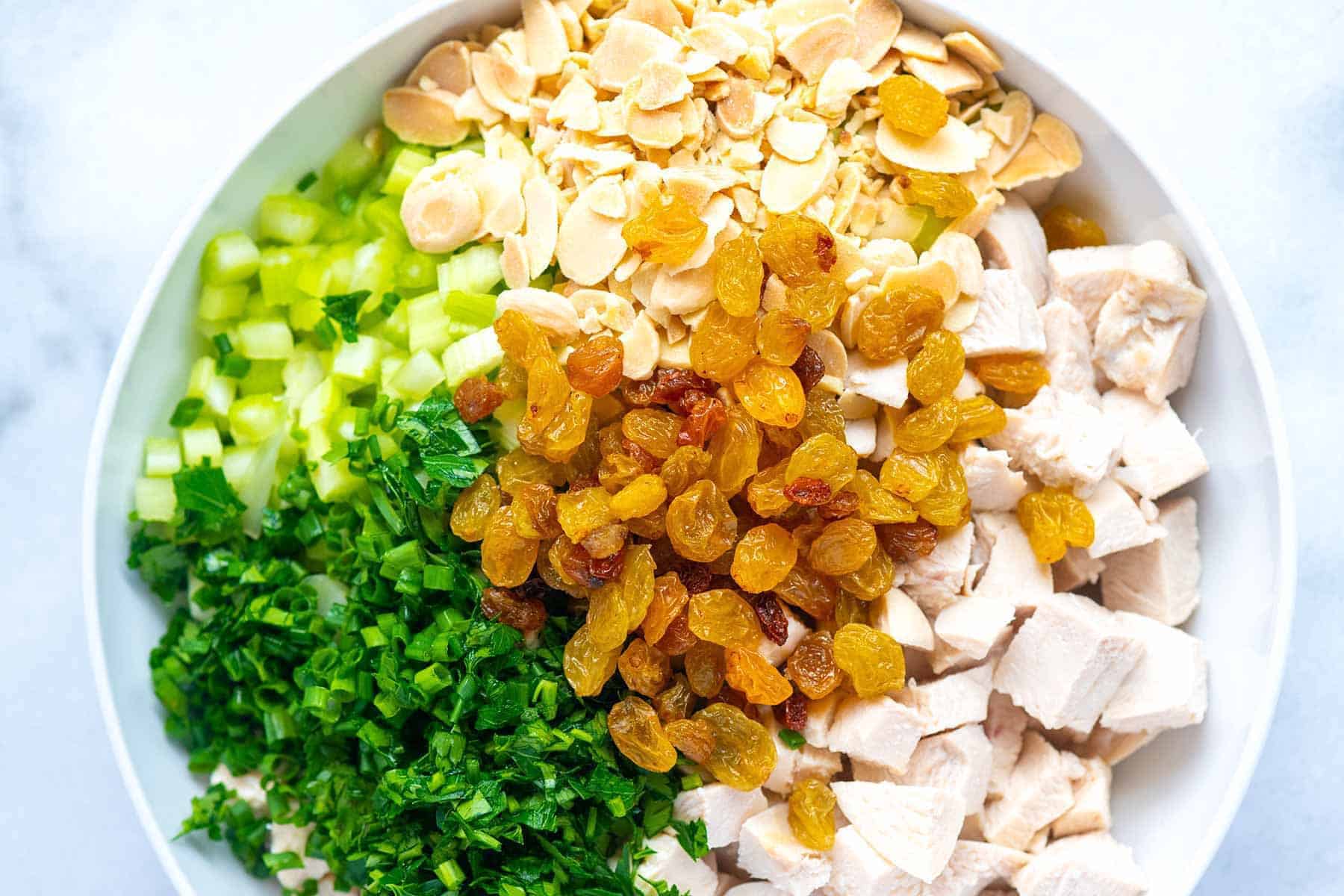 Chicken salad ingredients in a bowl