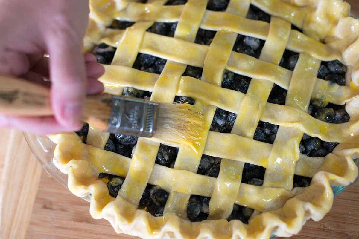 Brushing lattice crust with egg wash