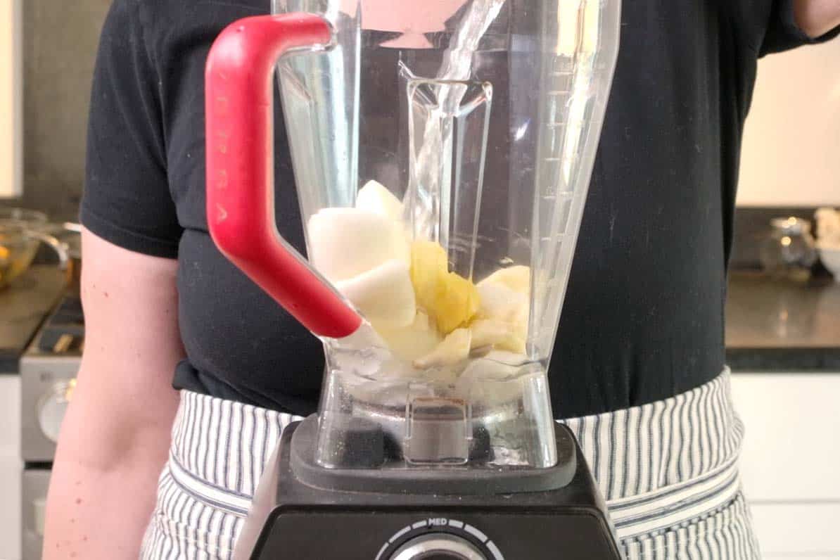 Blending onions, ginger, and garlic to make curry