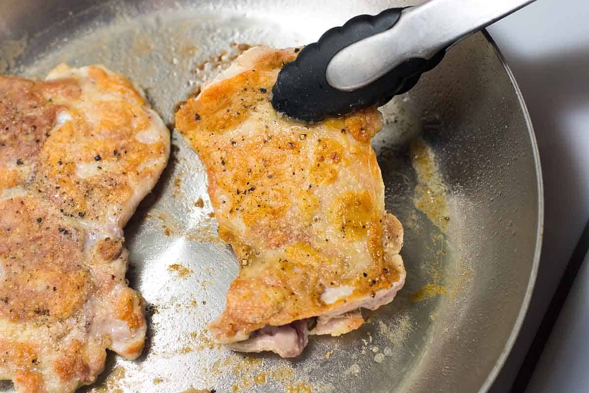 Cooking pounded and floured chicken in a skillet for chicken marsala