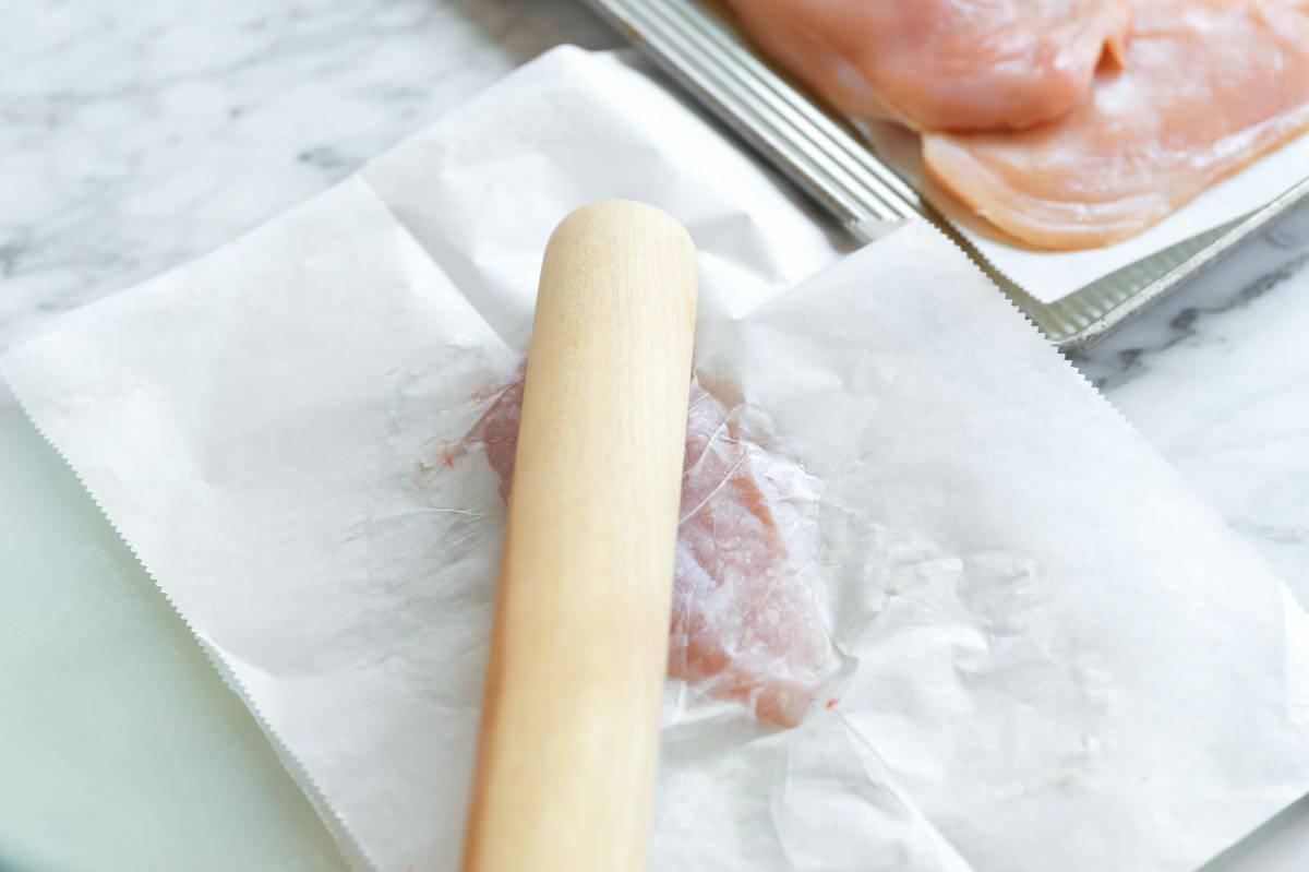 Pounding chicken breast cutlets thin for chicken milanese