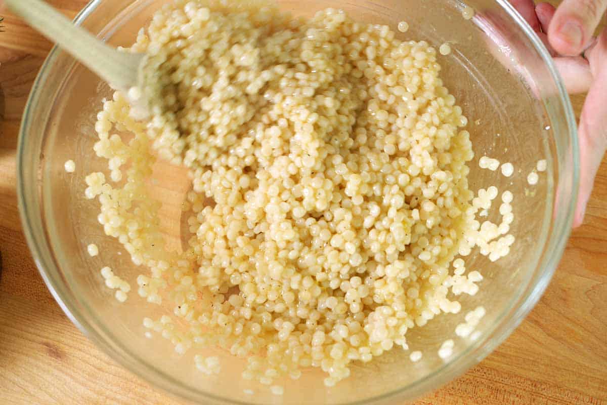 Adding hot couscous to the salad dressing
