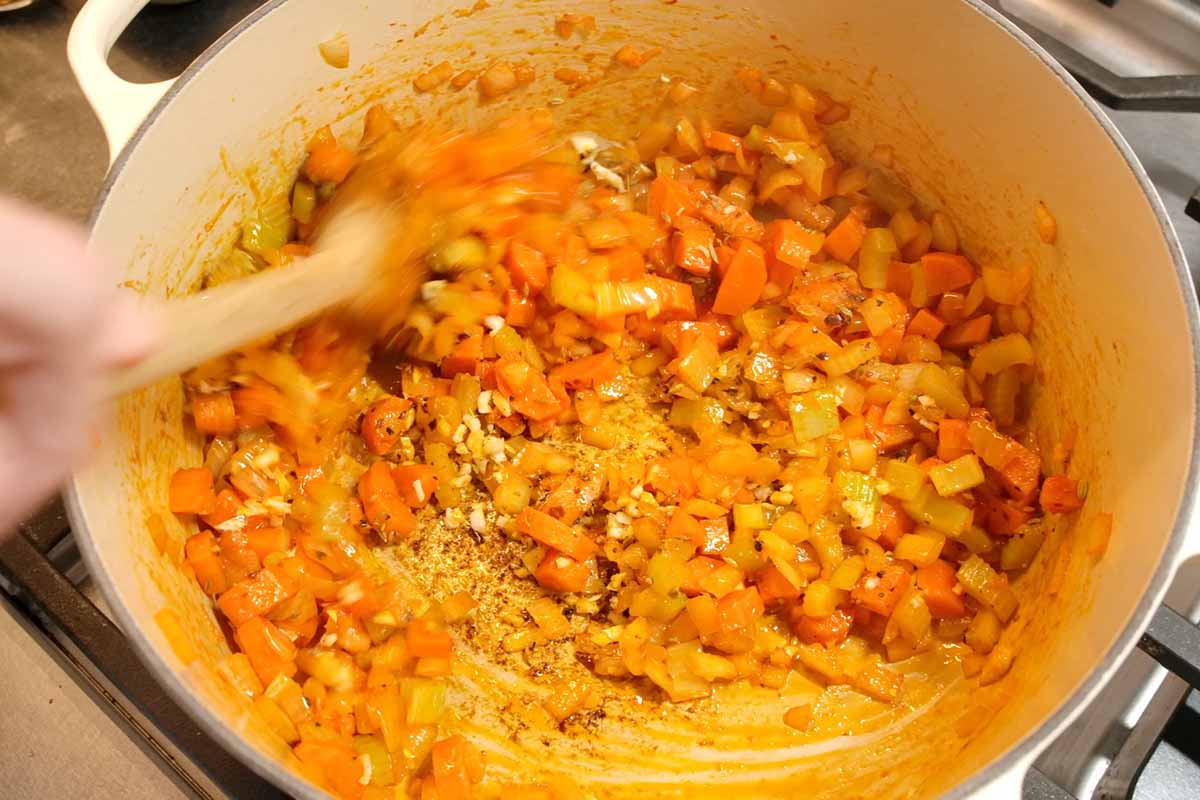 Adding spices to base of soup