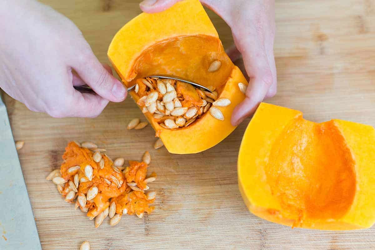 Removing seeds from butternut squash
