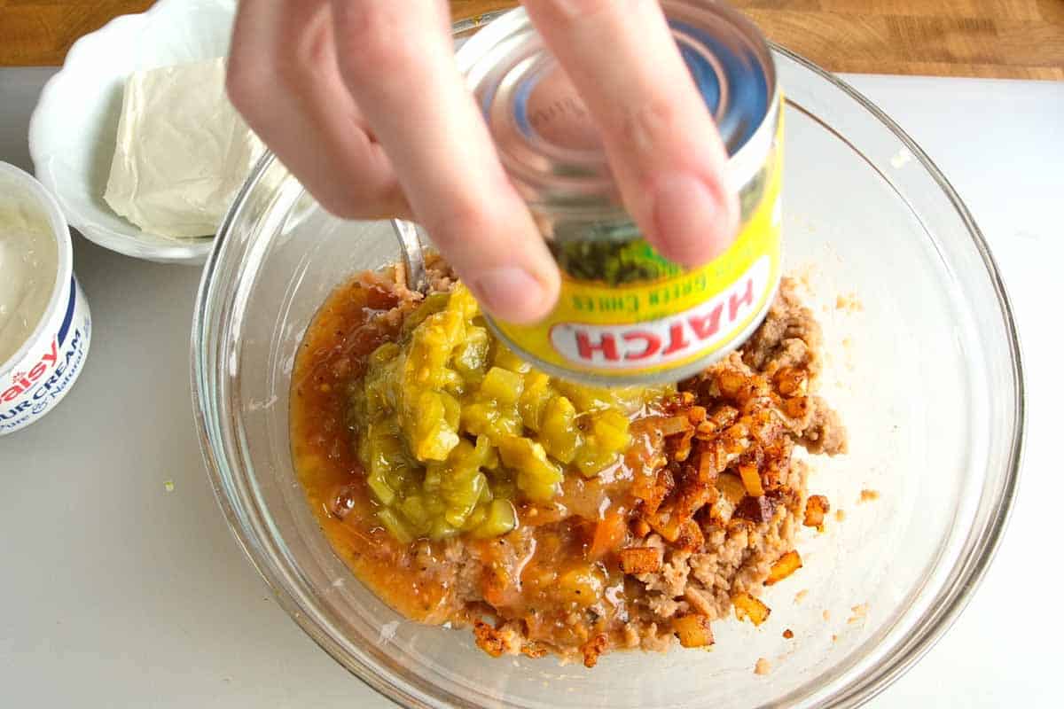 Stirring all the bean dip ingredients together in a bowl