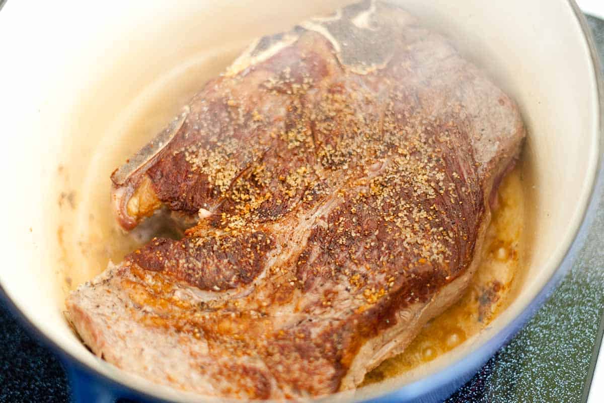 Browning chuck roast for shredded beef tacos