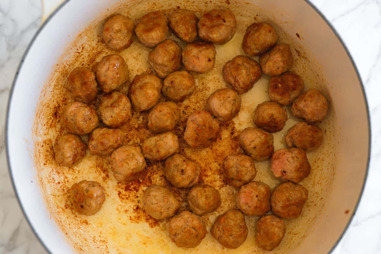 Browning turkey meatballs before making the soup