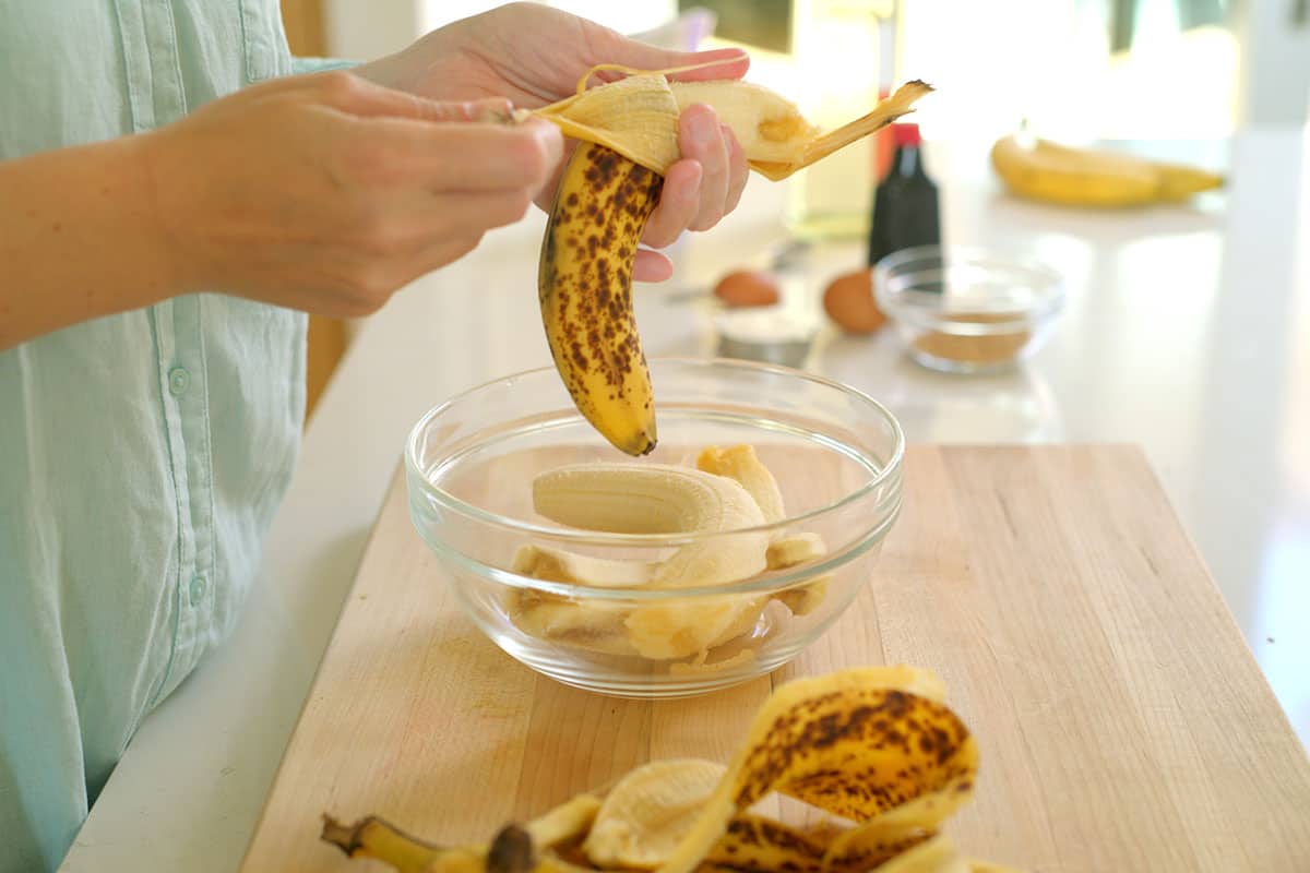 Peeling very ripe, brown and speckly bananas for banana cake