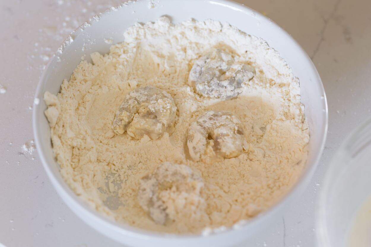 Dredging the shrimp in flour and cornstarch