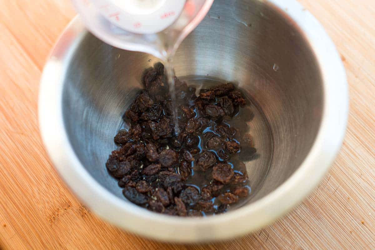 pouring hot water over raisins to plump them up before adding the bran muffin batter