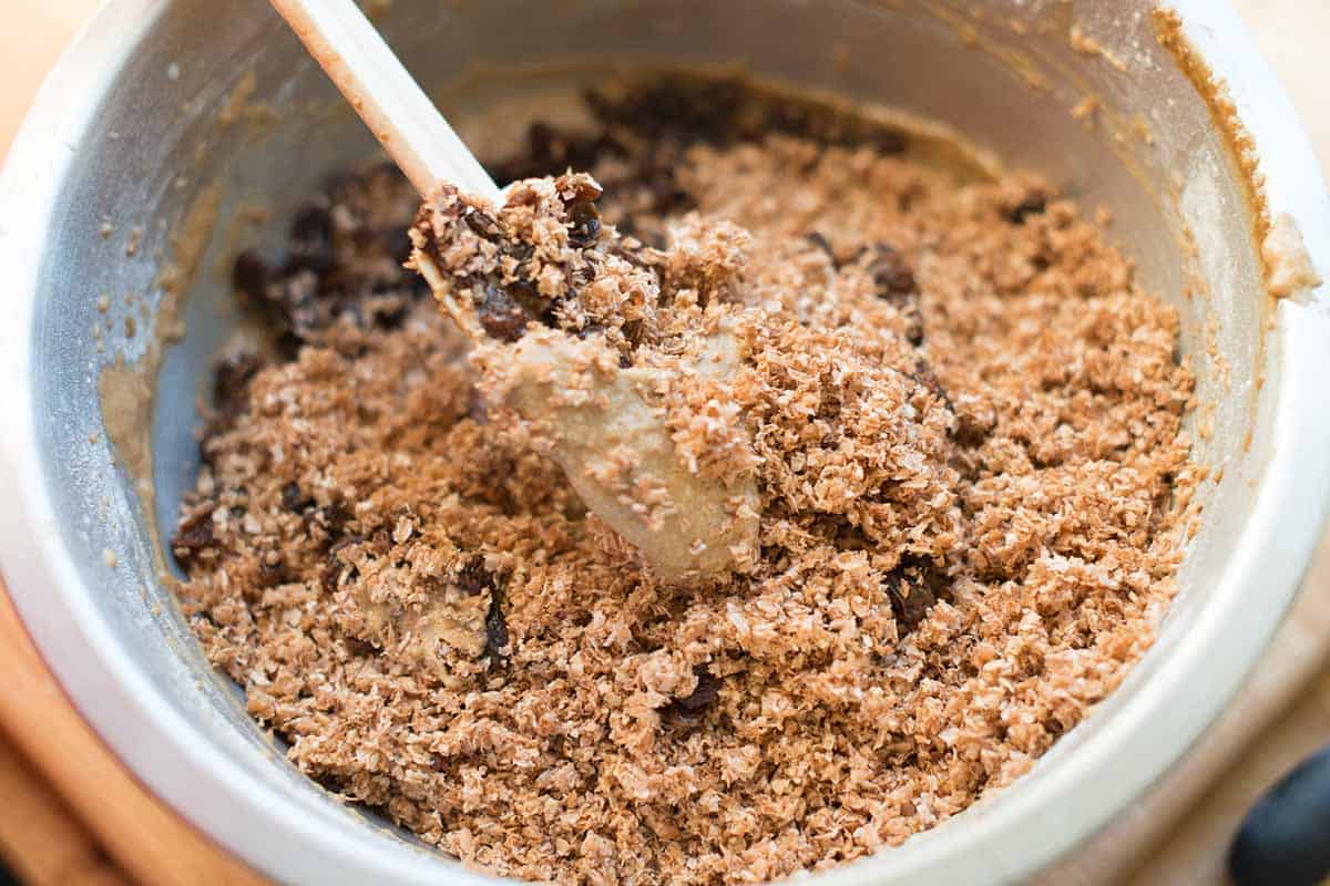 Folding the hydrated bran and raisins into the muffin batter