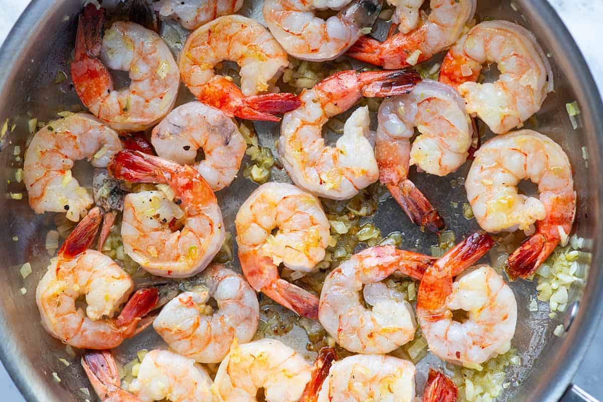Cooking shrimp in a skillet for shrimp scampi