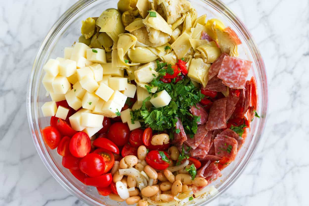 All of the antipasto salad ingredients in one big bowl.
