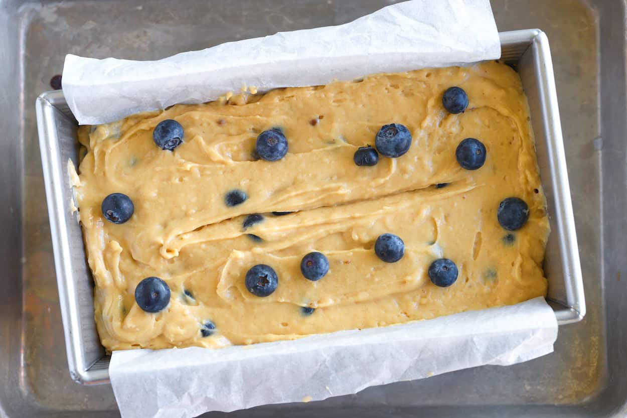 Adding 10 extra blueberries to the top of the batter in the loaf pan before baking