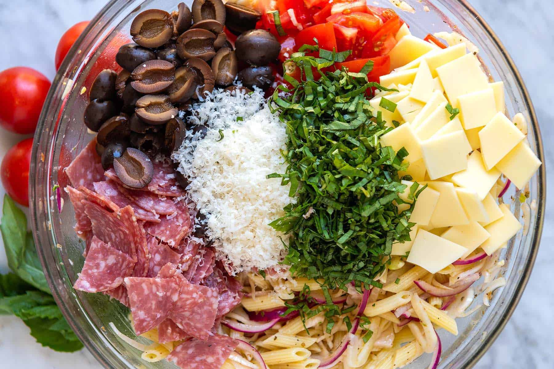 Italian pasta salad ingredients in a bowl