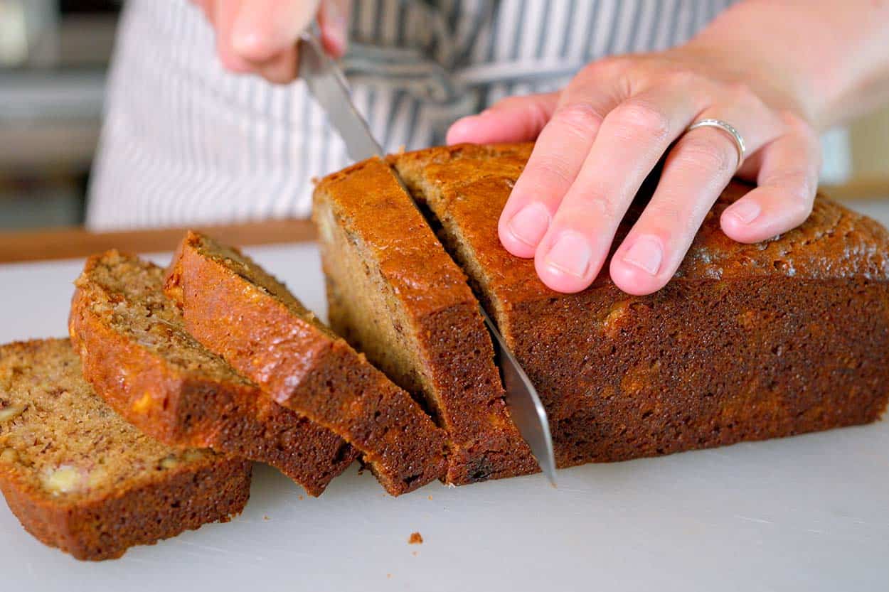 Slicing cooled banana bread