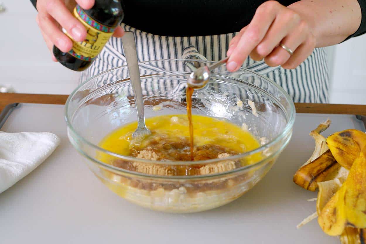 Mixing the wet ingredients for banana bread batter