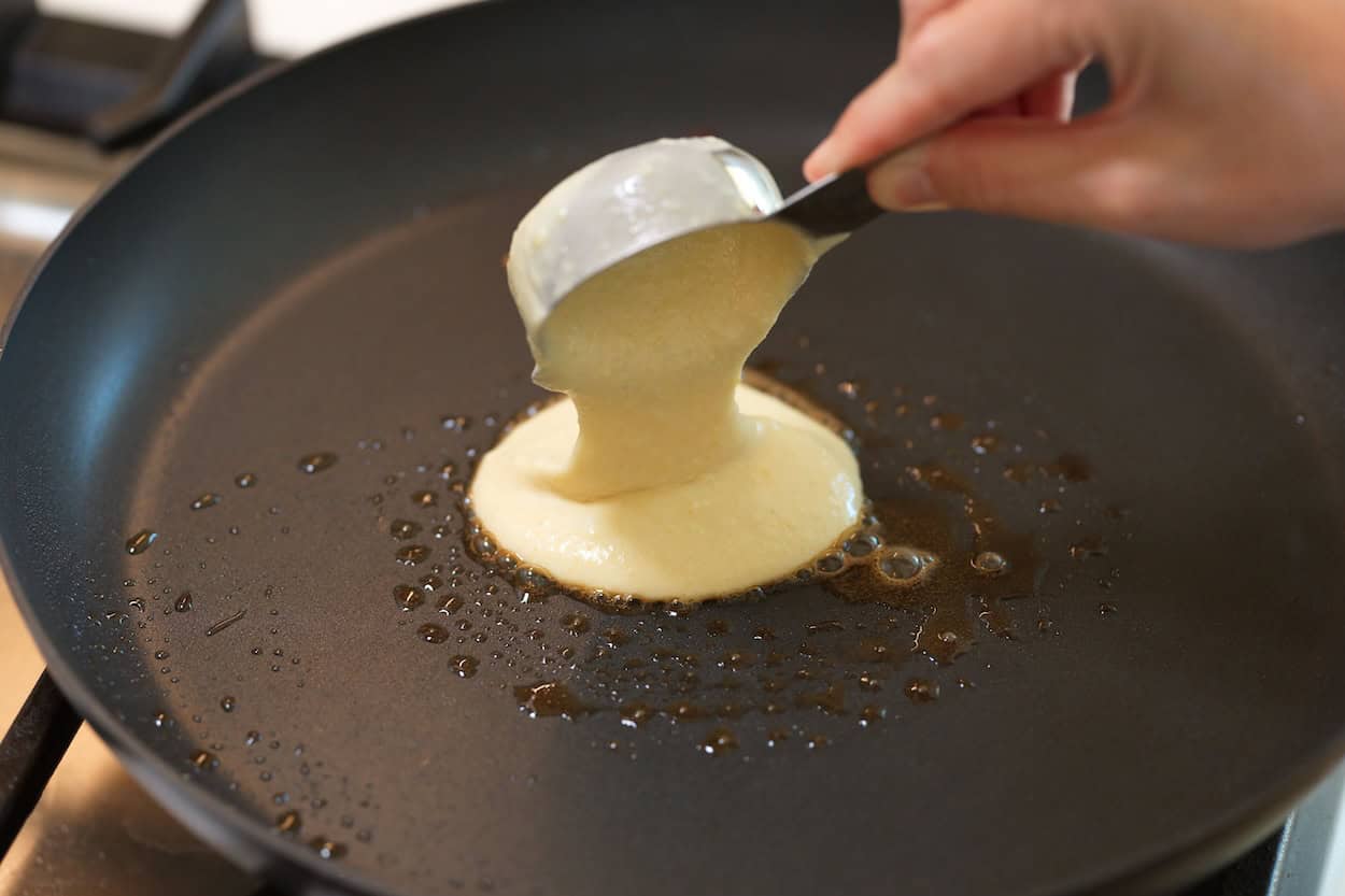 Cooking pancakes with melted butter